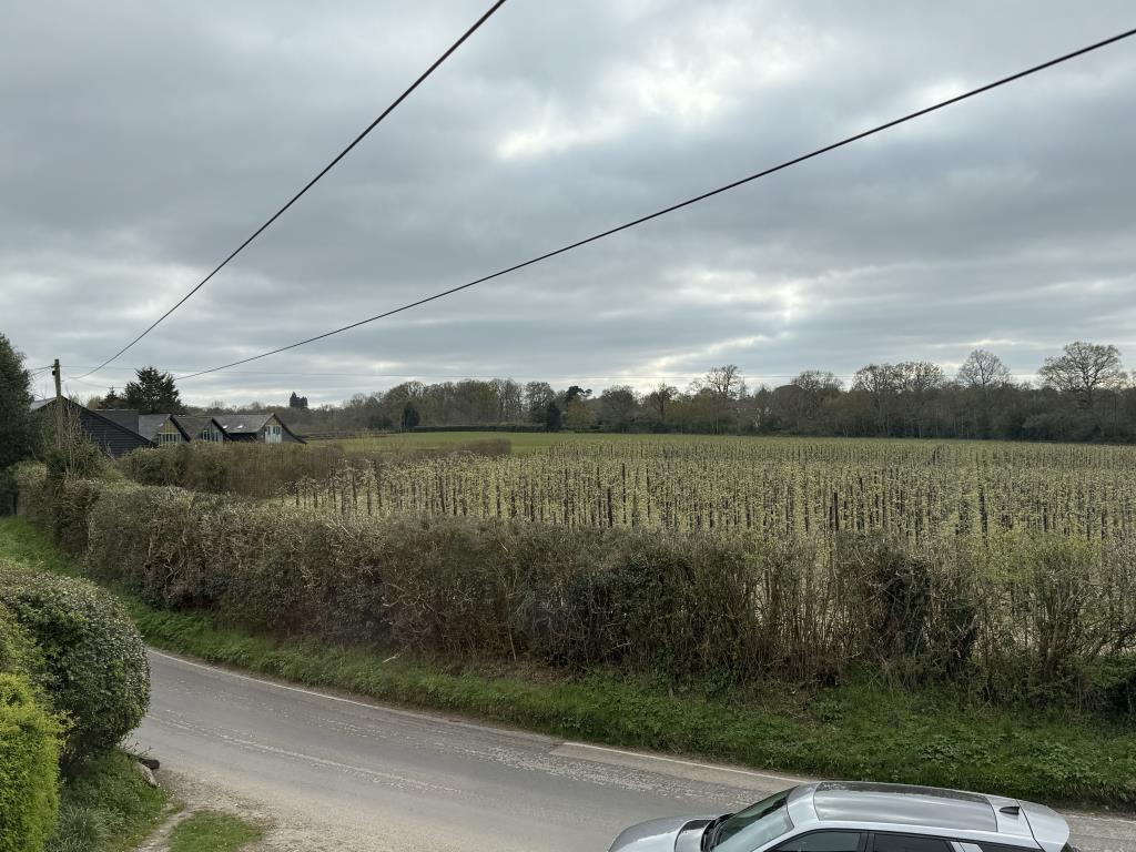 Lot: 155 - THREE-BEDROOM SEMI-DETACHED HOUSE ON OUTSKIRTS OF WEALDEN VILLAGE - Front view from Bedroom in rural semi in need of modernisation